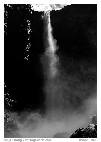 Bridalveil Falls as sun reaches upper shaft of water. Yosemite National Park, California, USA.