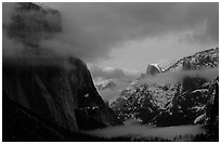 Valley view with fog, winter sunset. Yosemite National Park, California, USA. (black and white)