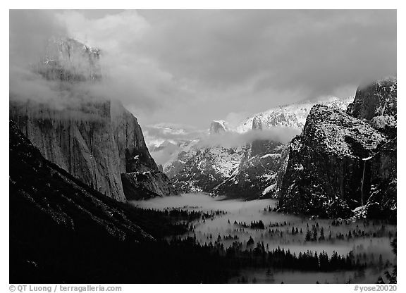 View with fog in valley and peaks lighted by sunset,  winter. Yosemite National Park (black and white)