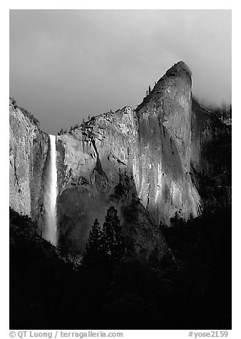 Bridalveil Falls and Leaning Tower, stormy sky. Yosemite National Park, California, USA.