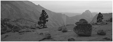 Erratic glacial boulders and Half-Dome at sunset. Yosemite National Park (Panoramic black and white)