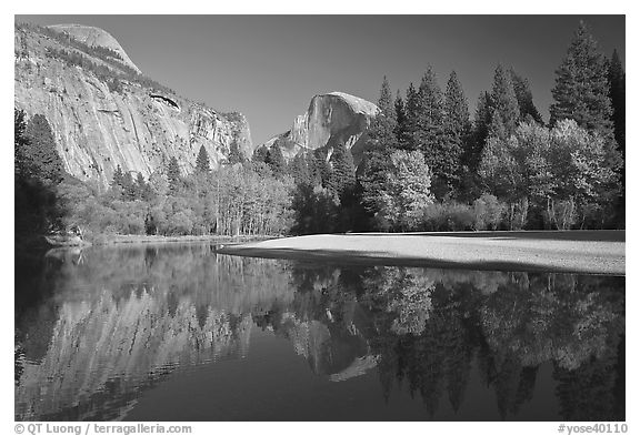 North Dome and Half Dome reflected in Merced River. Yosemite National Park (black and white)