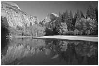 North Dome and Half Dome reflected in Merced River. Yosemite National Park, California, USA. (black and white)