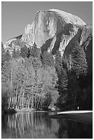 Banks of  Merced River with hiker below Half-Dome. Yosemite National Park, California, USA. (black and white)