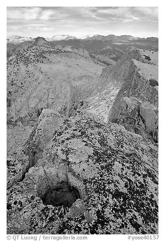 Frozen pot hole and summit cliffs, Mount Hoffman. Yosemite National Park, California, USA.