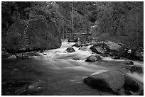 Merced River flowing past huge boulders, Lower Merced Canyon. Yosemite National Park, California, USA. (black and white)