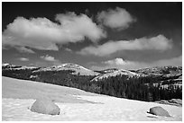 Snow on slab, boulders, and distant domes, Tuolumne Meadows. Yosemite National Park, California, USA. (black and white)