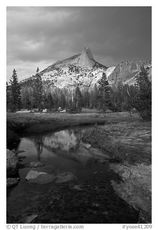 Cathedral Peak reflected in stream under stormy skies. Yosemite National Park (black and white)