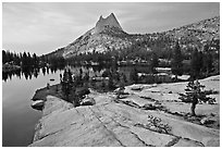 Granite slab, Upper Cathedral Lake, and Cathedral Peak, sunset. Yosemite National Park, California, USA. (black and white)