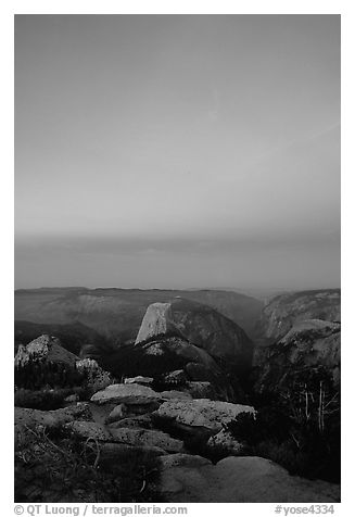 Half-Dome and Yosemite Valley under  pink hues of dawn sky. Yosemite National Park (black and white)