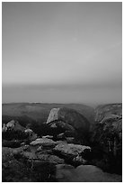 Half-Dome and Yosemite Valley under  pink hues of dawn sky. Yosemite National Park, California, USA. (black and white)