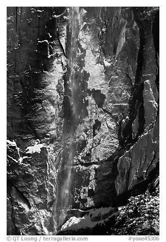 Upper Yosemite Falls and icy rock wall. Yosemite National Park (black and white)