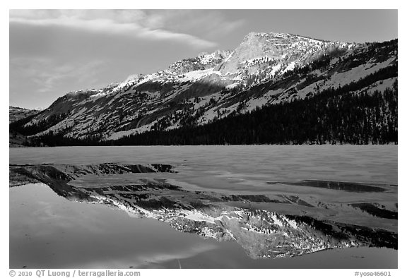 Tenaya Peak reflected in partly iced Tenaya Lake. Yosemite National Park, California, USA.