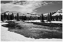 Creek flowing in snow-covered high country landscape. Yosemite National Park ( black and white)