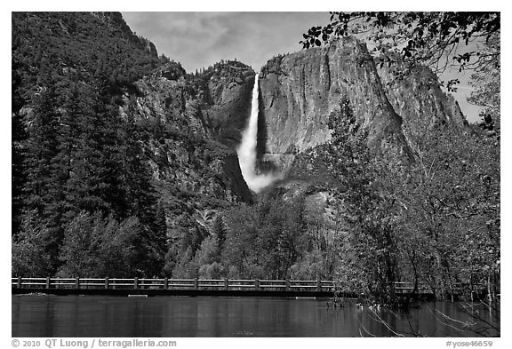 High waters of the Merced River under the Swinging Bridge. Yosemite National Park (black and white)