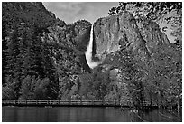 High waters of the Merced River under the Swinging Bridge. Yosemite National Park, California, USA. (black and white)