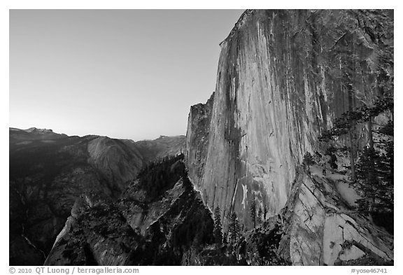 Hiker, Half-Dome and Tenaya Canyon from the Diving Board at dusk. Yosemite National Park (black and white)