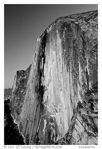 Hiker at the base of Half-Dome at dusk. Yosemite National Park (black and white)