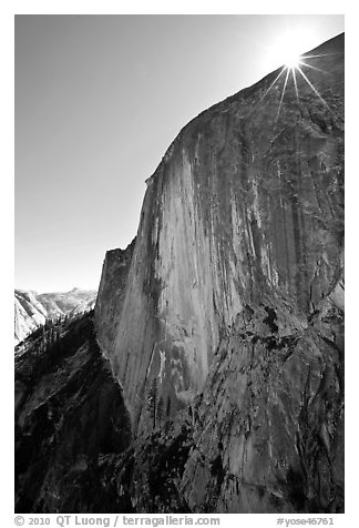 Sunburst at the top of Half-Dome face. Yosemite National Park (black and white)