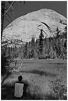 Hiker sitting at Lost Lake on west side Half-Dome. Yosemite National Park ( black and white)