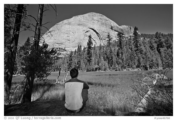 Hiker looking at backside of Half-Dome from Lost Lake. Yosemite National Park (black and white)