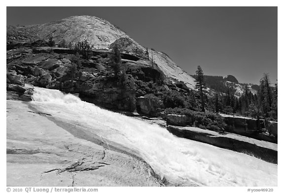 Merced River flowing over smooth granite in Upper Canyon. Yosemite National Park, California, USA.