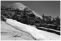 Merced River flowing over smooth granite in Upper Canyon. Yosemite National Park, California, USA. (black and white)