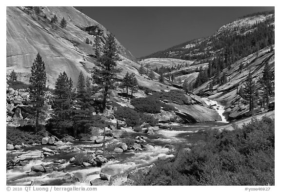 River flowing in smooth granite canyon. Yosemite National Park, California, USA.