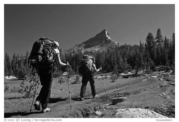 Women backpacking on John Muir Trail below Tressider Peak. Yosemite National Park, California, USA.