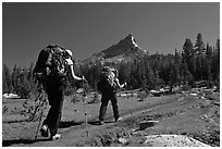 Women backpacking on John Muir Trail below Tressider Peak. Yosemite National Park, California, USA. (black and white)
