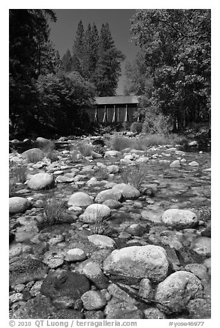 Pebbles in river and covered bridge, Wawona. Yosemite National Park (black and white)