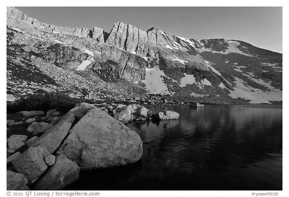 Shore of Upper McCabe Lake with North Peak at sunset. Yosemite National Park, California, USA.