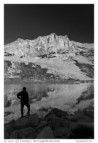 Hiker standing  on Roosevelt lakeshore. Yosemite National Park (black and white)