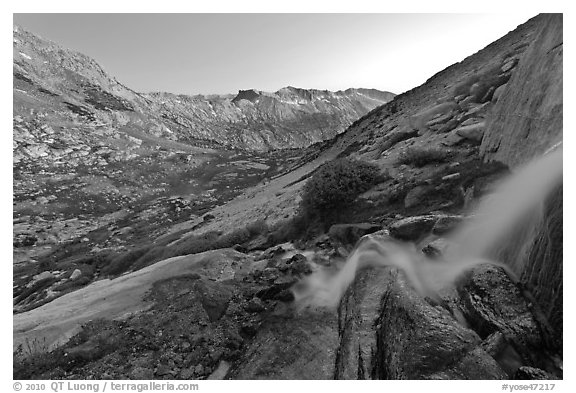 Waterfall and alpine valley at sunset. Yosemite National Park, California, USA.