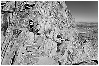 Hiker on summit block of Mount Conness. Yosemite National Park ( black and white)
