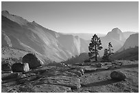 Erratic boulders, pines, Clouds rest and Half-Dome from Olmstedt Point, late afternoon. Yosemite National Park, California, USA. (black and white)