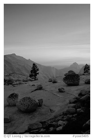 Glacial erratics, pine trees, Clouds rest and Half-Dome from Olmstedt Point, sunset. Yosemite National Park, California, USA.