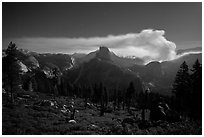 Half-Dome and plume of smoke from forest fire at night. Yosemite National Park ( black and white)
