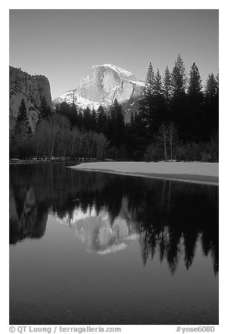 Half-Dome reflected in Merced River, winter sunset. Yosemite National Park, California, USA.