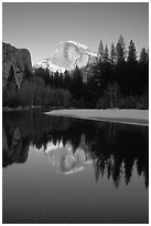 Half-Dome reflected in Merced River, winter sunset. Yosemite National Park, California, USA. (black and white)