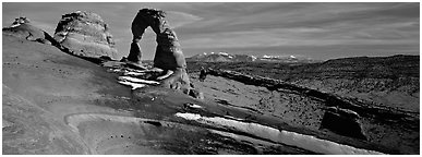 Delicate Arch and snowy mountain. Arches National Park (Panoramic black and white)