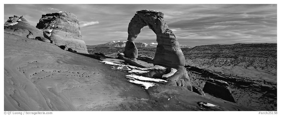 Red sandstone of Delicate Arch and blue shades of snow. Arches National Park (black and white)
