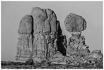 Balanced rock and sandstone tower. Arches National Park, Utah, USA. (black and white)