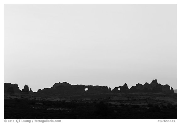 Windows Group backlit at sunrise. Arches National Park, Utah, USA.