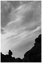 Sunset clouds and small balanced rock. Arches National Park, Utah, USA. (black and white)