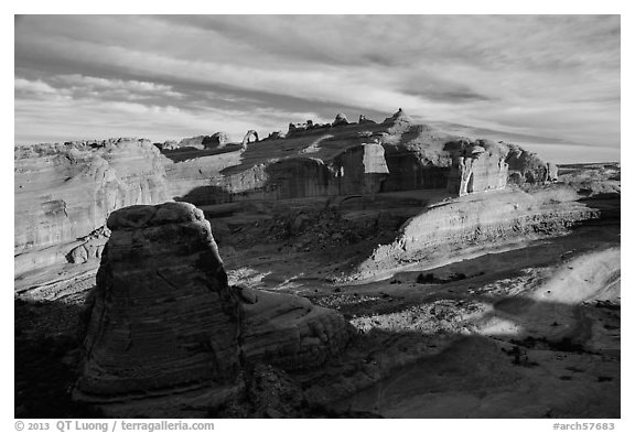 Winter Camp Wash and Delicate Arch at sunrise. Arches National Park, Utah, USA.