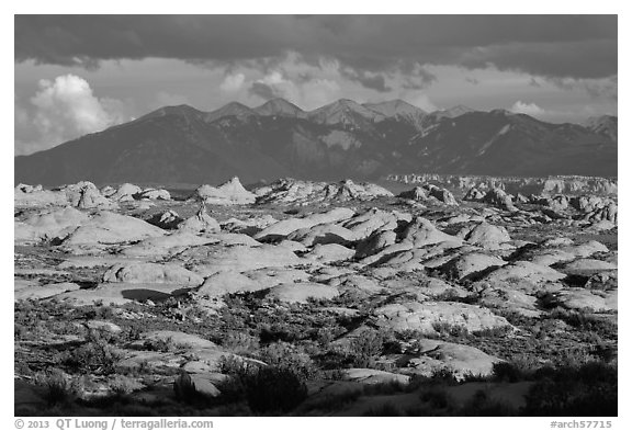 Petrified dunes and cloudy La Sal mountains. Arches National Park (black and white)