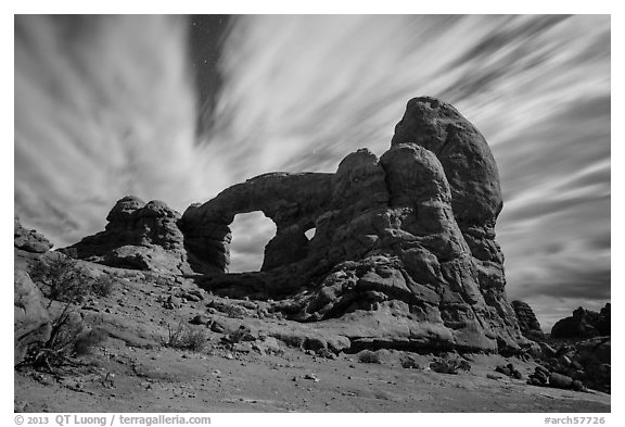 Turret Arch at night, lit by moon. Arches National Park, Utah, USA.