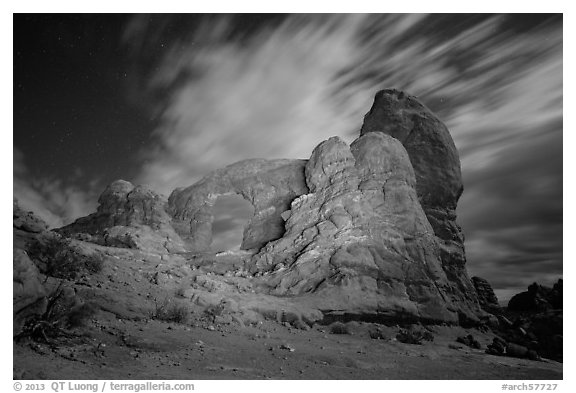 Turret Arch at night, lit by light. Arches National Park, Utah, USA.