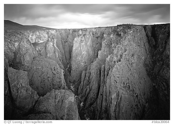 Narrow gorge under dark clouds. Black Canyon of the Gunnison National Park (black and white)